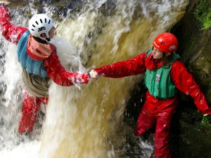 Explorer Scouts canyoning at their camp in Wales